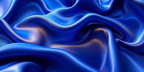 Obraz premium A close-up view of flowing, draped, deep blue silk fabric
