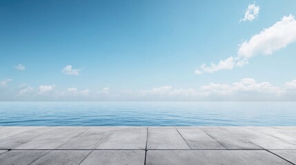 Obraz premium Tranquil Concrete Pier Under Bright Blue Sky with Soft Clouds and Calm Sea Waters Ideal for Text Overlay and Coastal Themes
