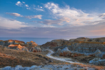Desert landscapes with colored rocks of eastern Kazakhstan in the area of the Bukhtarma reservoir. Cape Shekelmes on Lake Zaisan.