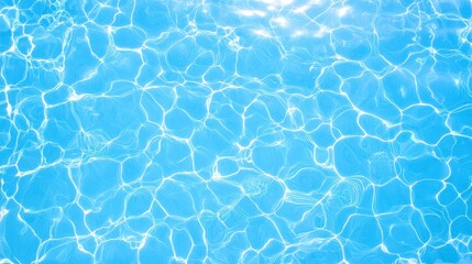 Aerial view of a pool with crystal clear water and sunlight reflecting on the surface