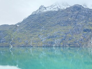 Natural landscape of Alaska lake and snowcapped mountains