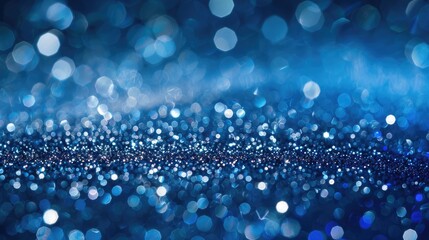 Abstract blue and silver glitter background for Christmas festivities.