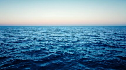 Obraz premium Serene Ocean Waves Under a Peaceful Sunset Sky