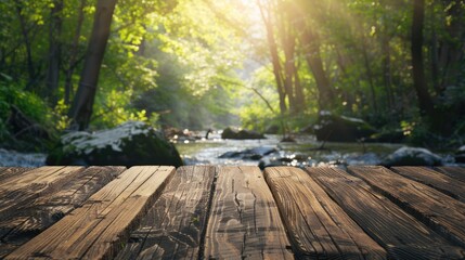 Wooden table top with blurred stream and forest background for product display or design layout with space for text.