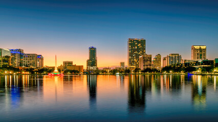 Orlando city skyline at sunset. Panoramic view of Orlando in Lake Eola Park, Florida, USA	