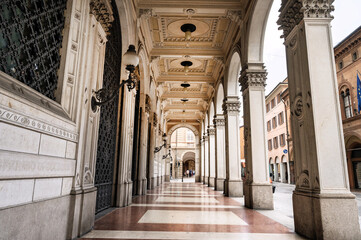 A street with porticoes at the historic center of Bologna in Italy. © Giannis