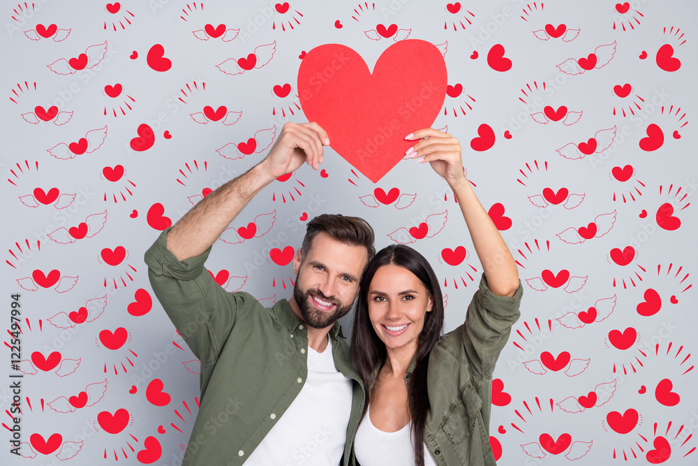Poster portrait of attractive cheerful couple hugging holding heart card shape form cupid isolated over gre