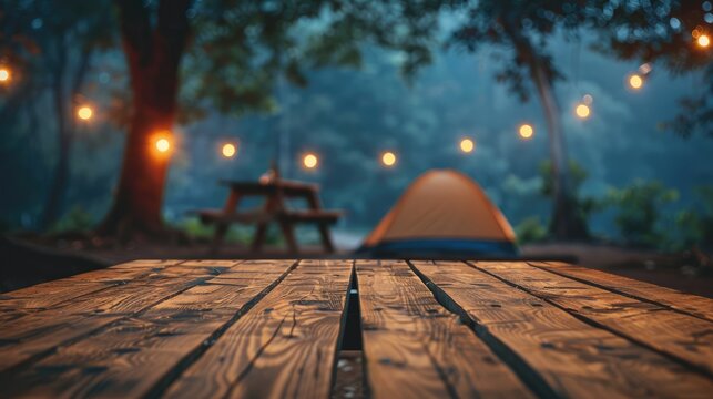 Blurry camping tent at night with wooden table top, ideal for product display or design.