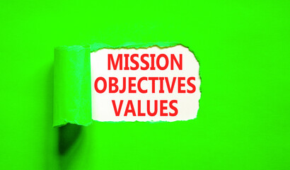 Mission objectives values symbol. Concept words Mission Objectives Values on beautiful white paper. Beautiful green table green background. Business mission objectives values concept. Copy space.
