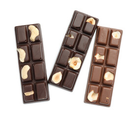 Tasty chocolate bars with nuts isolated on white, top view