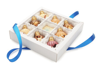 Box with delicious chocolate in shape of Christmas ornaments isolated on white