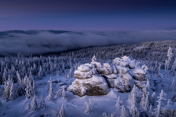 Winter landscape of Šumava. Beautiful landscape picture. Nature of Šumava. Czech Republic. Winter motif. Snowy region. Sunrise over the mountains. 