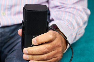 Journalist. Man's hand with a microphone, possibly a journalist doing an interview