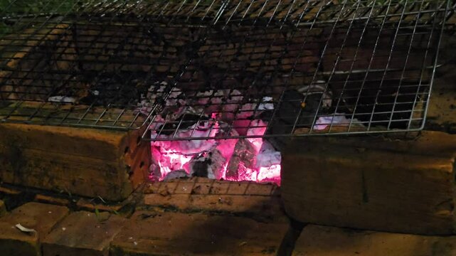 The glowing red embers,hot charcoal briquettes,preparing for barbecue or barbeque or bbq