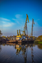 cargo cranes at the port on the Pregolya river in Konigsberg