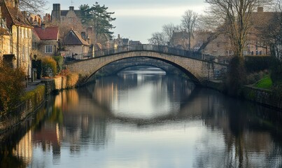 Stone Bridge Over Calm River in Quaint Village Setting