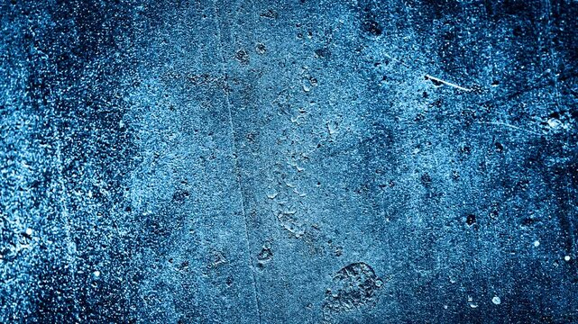 wall painted with blue paint with an interesting texture