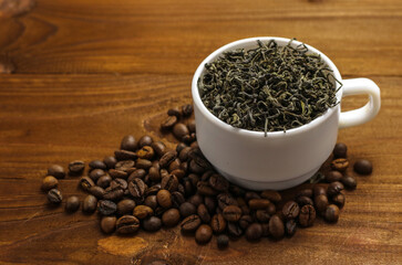 Coffee beans and tea leaves on table. Spices. Concept of taste and choice                      