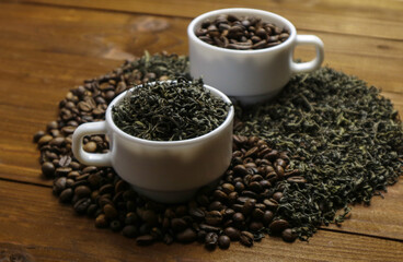 Coffee beans and tea leaves on table. Spices. Concept of taste and choice                      