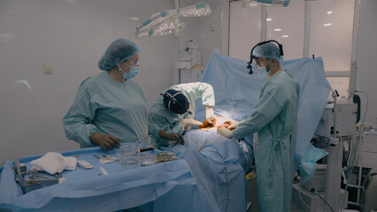 Medical team men doctors physicians surgeons nurse processing surgical operation in hospital clinic...