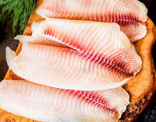 Fresh fish fillet on the chopping board. Organic fresh fish.