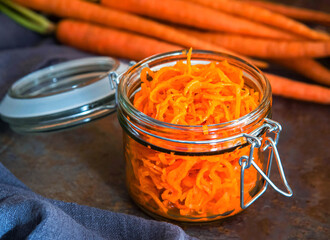 Healthy organic carrot salad in jar.