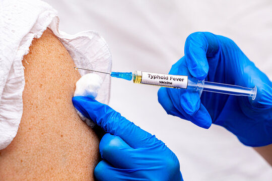 Doctor set shoulder injection to young pretty girl. Kid vaccine medical immunization. Cotton and syringe neat child arm. Medical hand. medicine pediatrician clinic. Sick baby. Copyspace. Horizontal