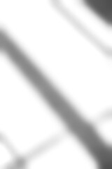 Shadow overlay effect for photo background.Grey drop diagona of light from window on a white wall. Natural light reflection