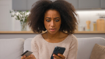 Stressed displeased African american woman female buyer ethnic customer girl pay online service...