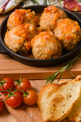 Meatballs with Rice in Tomato Sauce on a Cast Iron Pan