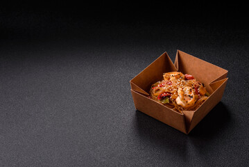 Glass noodles with shrimps and seafood, vegetables, spices and soy sauce