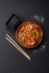 Glass noodles with shrimps and seafood, vegetables, spices and soy sauce