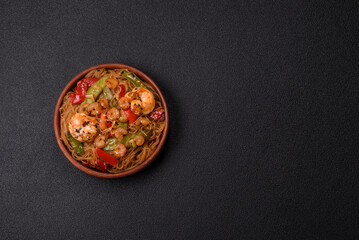 Glass noodles with shrimps and seafood, vegetables, spices and soy sauce