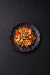 Rice with shrimps and seafood, vegetables, spices and soy sauce