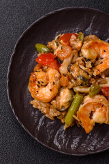 Rice with shrimps and seafood, vegetables, spices and soy sauce