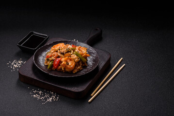 Rice with shrimps and seafood, vegetables, spices and soy sauce