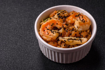 Rice with shrimps and seafood, vegetables, spices and soy sauce
