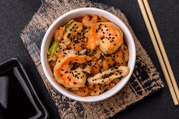 Rice with shrimps and seafood, vegetables, spices and soy sauce