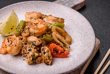 Rice with shrimps and seafood, vegetables, spices and soy sauce