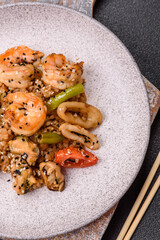 Rice with shrimps and seafood, vegetables, spices and soy sauce