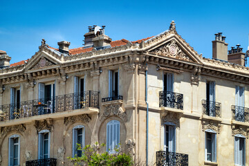 Traditional french building facade in Cannes over blue sky