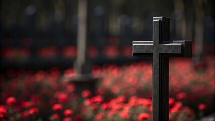 Mourning in silence a dark cross stands in a blurry graveyard memorializing death among flowers