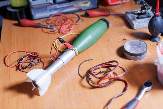 improvised explosive device being constructed on table from military rocket