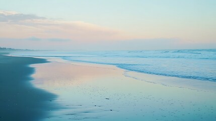 Obraz premium A tranquil beach at dusk with the last light of day reflecting off the water and the sound of gentle waves 