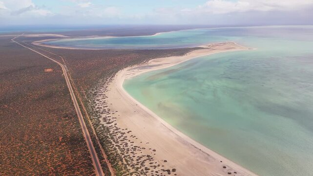 Aerial view of shell beach with clear water and tranquil coastline, Shark Bay, Australia.