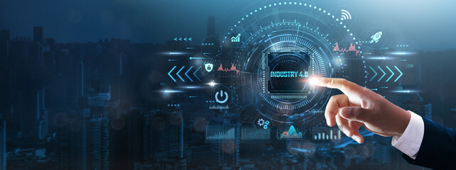 Industry 4.0: Businessman’s hand touching futuristic technological interface, automation, smart factories, IoT integration, digital transformation, business innovation, and technology concept.