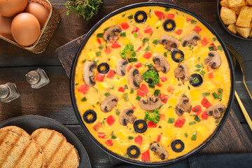 Delicious Mediterranean veggie omelette. Top view with close up.