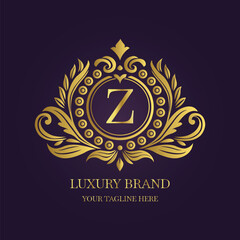 Gold Letter 'Z' Logo with Ornamental Patterns and Floral Motifs on Purple  
