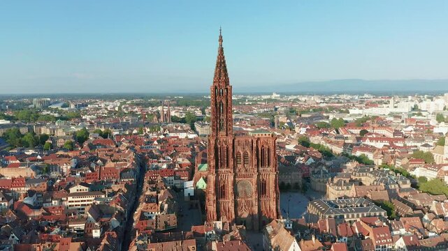 Aerial view of notre dame cathedral amidst scenic old town with red roofs, strasbourg, france.