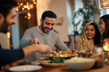 Happy Middle Eastern family enjoys in Ramadan dinner at dining table. 
